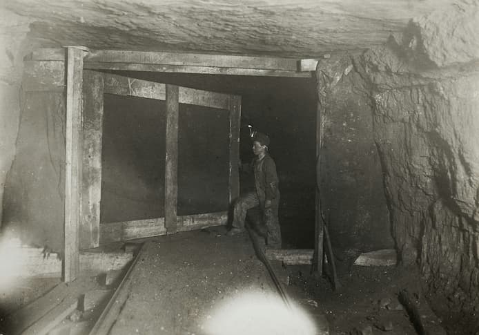 Boy miner operating the doors