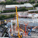The final section of the huge Kop roof truss has been lifted into place. Credit: Roberts and Daughter