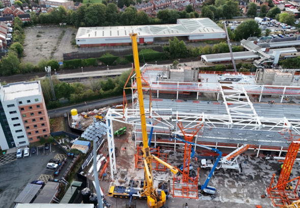 The final section of the huge Kop roof truss has been lifted into place. Credit: Roberts and Daughter